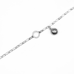 Load image into Gallery viewer, Asteroid City Charm on charm bracelet on white background
